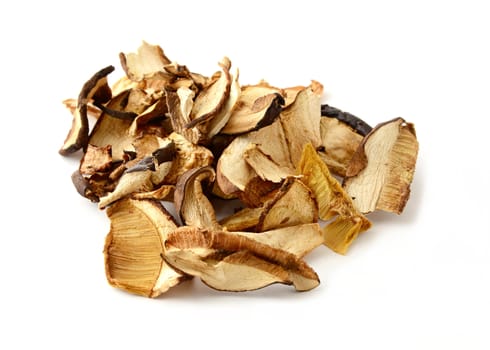 Heap of dried sliced forest mushrooms on white background.