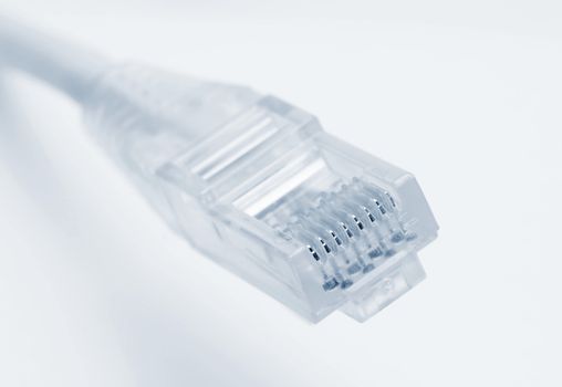 Closeup of rj45 connector of patch cable for LAN connection over white background.