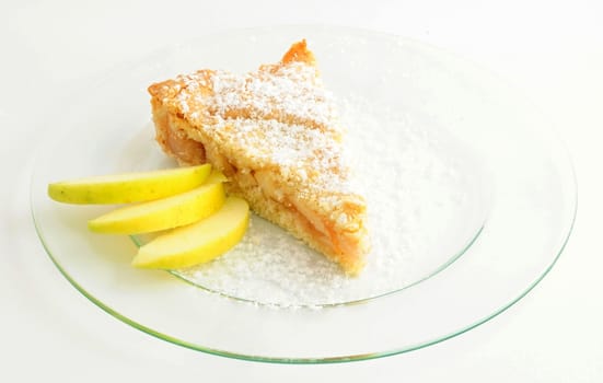 One serving of apple cake on white background.