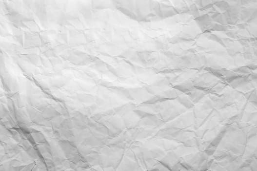 Full frame texture of blank crumpled and wrinkled white paper background.