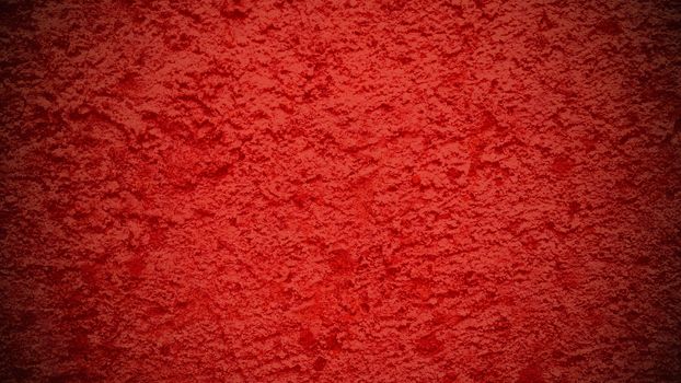 Red grunge background with concrete texture.