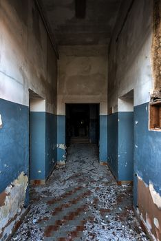 Damaged building interior with large doorway and blue lines