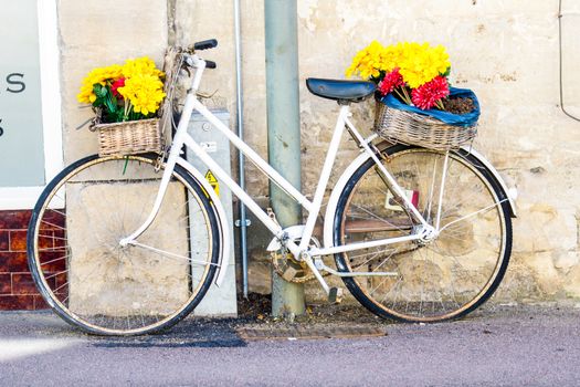 Old bicycle leaning against a shop doorway