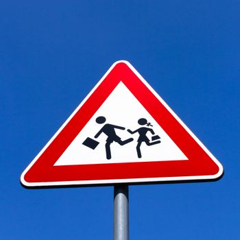 Road Sign of crosswalk of students, in vertical composition.