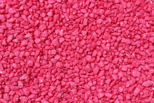 The picture shows a background with red decoration granules