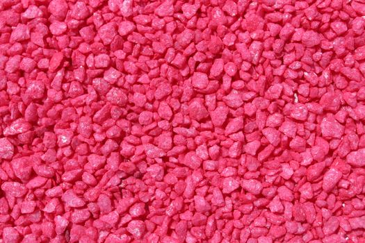 The picture shows a background with red decoration granules