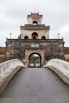 Hue, old capital of Vietnam from 1802 to 1945.. Architecture and details of buildings. A major attraction is its vast, 19th-century Dai Noi Citadel, surrounded by a moat and thick stone walls. It encompasses the Imperial City, with palaces and shrines. High quality photo