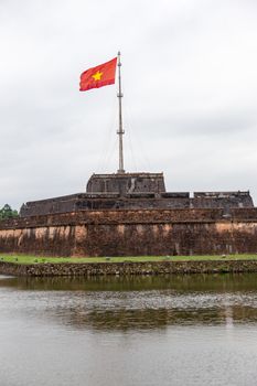 Hue, old capital of Vietnam from 1802 to 1945.. Architecture and details of buildings. A major attraction is its vast, 19th-century Dai Noi Citadel, surrounded by a moat and thick stone walls. It encompasses the Imperial City, with palaces and shrines. High quality photo