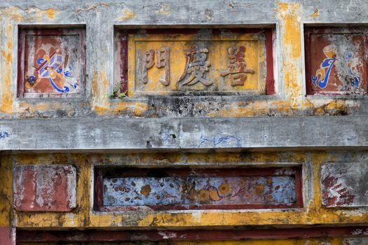 Hue, old capital of Vietnam from 1802 to 1945.. Architecture and details of buildings. A major attraction is its vast, 19th-century Dai Noi Citadel, surrounded by a moat and thick stone walls. It encompasses the Imperial City, with palaces and shrines. High quality photo