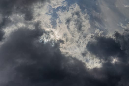 Gray summer storm clouds full frame background. Zenith view from ground surface.