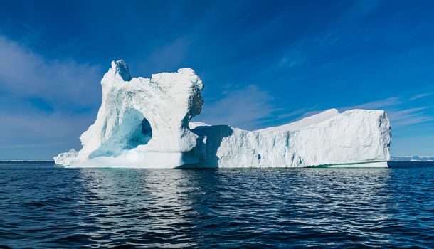 Climate Change and Global Warming Concept. Icebergs from melting glacier in icefjord in Ilulissat, Greenland. Photo of arctic nature ice landscape.