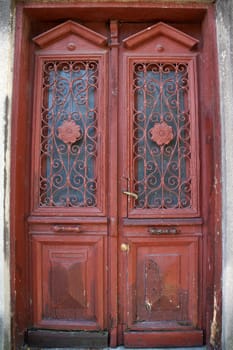 vintage entrance wooden brown door with glass close up
