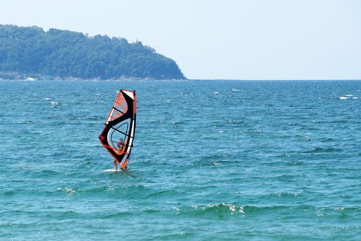 Varna, Bulgaria - July, 31, 2020 man windsurfing in the sea