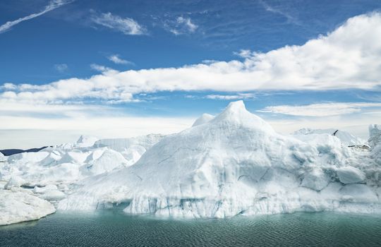 Climate Change. Iceberg afrom glacier in arctic nature landscape on Greenland. Icebergs in Ilulissat icefjord. Famously affected by global warming.