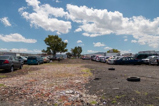 Old damaged cars on the junkyard waiting for recycling in Mexico City. Mexico