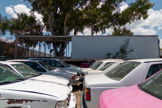 Old damaged cars on the junkyard waiting for recycling in Mexico City. Mexico