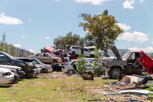 Old damaged cars on the junkyard waiting for recycling in Mexico City. Mexico