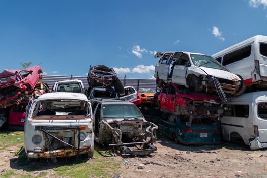 Old damaged cars on the junkyard waiting for recycling in Mexico City. Mexico