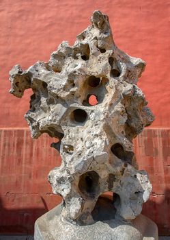 Large abstract rock closeup photo against red background