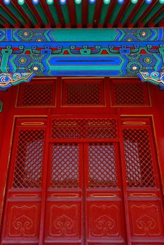 Gateway with red Chinese doors closeup photo