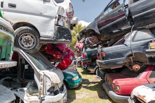 Old damaged cars on the junkyard waiting for recycling in Mexico City. Mexico