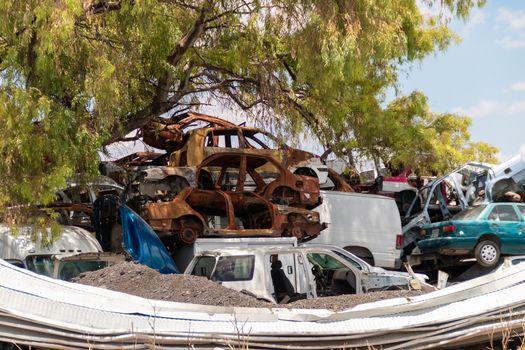 Old damaged cars on the junkyard waiting for recycling in Mexico City. Mexico