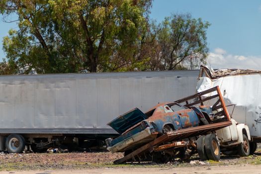 Old damaged cars on the junkyard waiting for recycling in Mexico City. Mexico