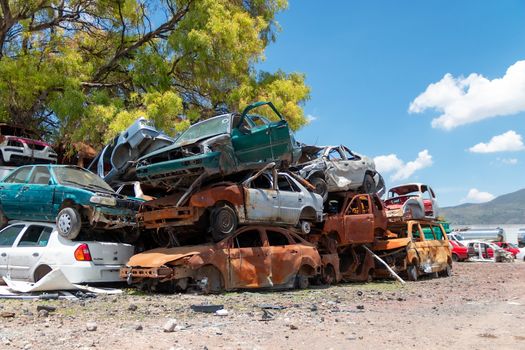 Old damaged cars on the junkyard waiting for recycling in Mexico City. Mexico