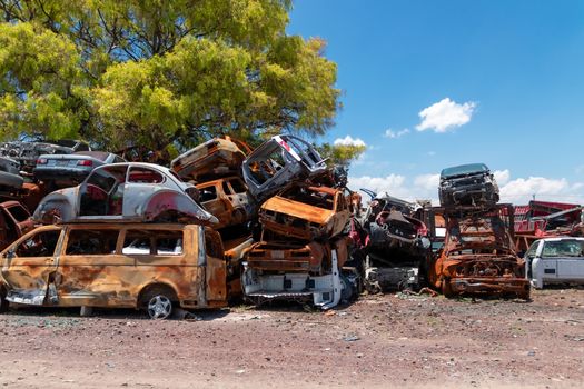 Old damaged cars on the junkyard waiting for recycling in Mexico City. Mexico