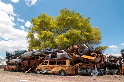 Old damaged cars on the junkyard waiting for recycling in Mexico City. Mexico