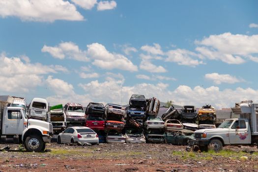 Old damaged cars on the junkyard waiting for recycling in Mexico City. Mexico