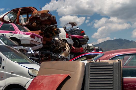 Old damaged cars on the junkyard waiting for recycling in Mexico City. Mexico