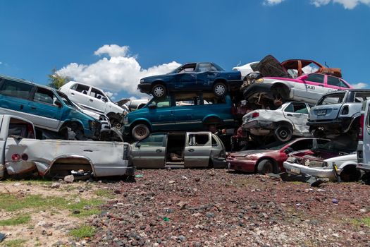 Old damaged cars on the junkyard waiting for recycling in Mexico City. Mexico