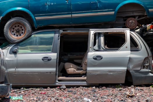 Old damaged cars on the junkyard waiting for recycling in Mexico City. Mexico