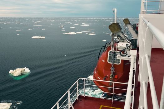 The feed of a ship sailing in the Arctic. Landscape of the Arctic from the deck of the tanker.