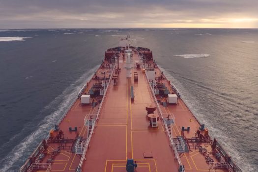 The feed of a ship sailing in the Arctic. Landscape of the Arctic from the deck of the tanker.