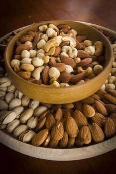 Set of various nuts in a wooden bowl