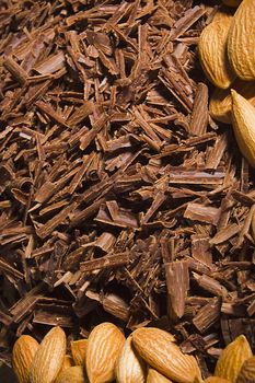 Almond nuts and delicious grated chocolate closeup