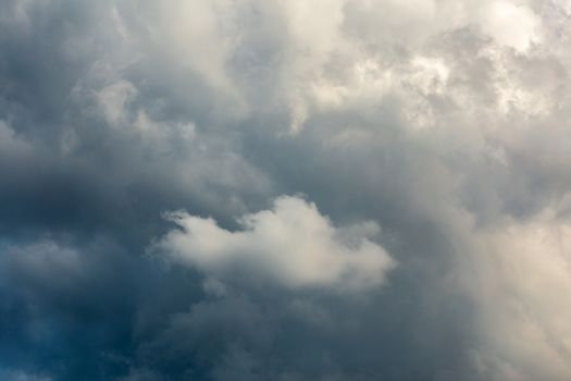 Incoming storm close-up cloudscape at march daylight in continental europe. Captured with telephoto lens.