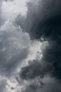 gray incoming storm clouds dark closeup backdrop, captured on 100 mm telephoto lens