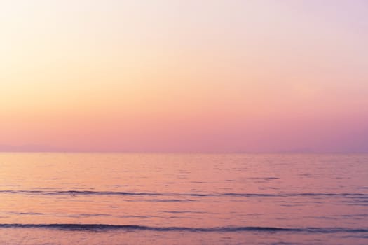 Tropical nature clean beach and white sand in summer with sun light blue sky and bokeh abstract  background.