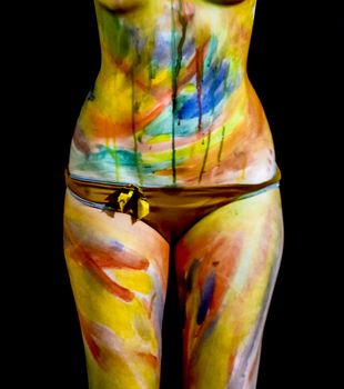 Body art. Drawing on the body. Beautiful girl with painted body watercolors. A white young girl painted the body with paint.