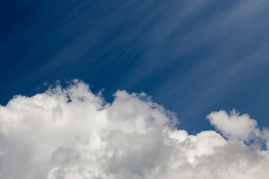 White cloud and blue sky at daylight. Close shot wit telephoto lens and polarizing filter with minimalistic composition.