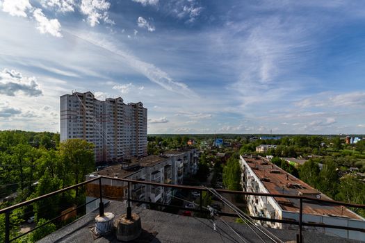 summer day view on russian suburb condominium houses from roof.