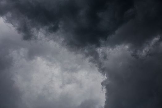 gray incoming storm clouds dark closeup backdrop, captured on 100 mm telephoto lens