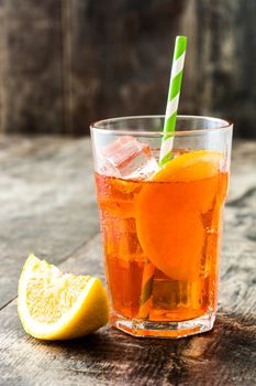 Aperol spritz cocktail in glass on wooden table