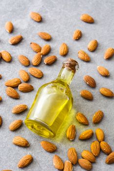 Almond oil in bottle on gray stone