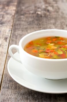 Vegetable soup in bowl on wooden table