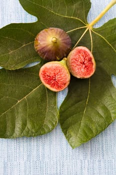 Fresh figs isolated on blue background