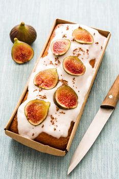 Delicious fig cake on blue background